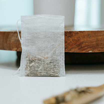 biodegradable drawstring tea bags from IngenuiTea™ with tea inside