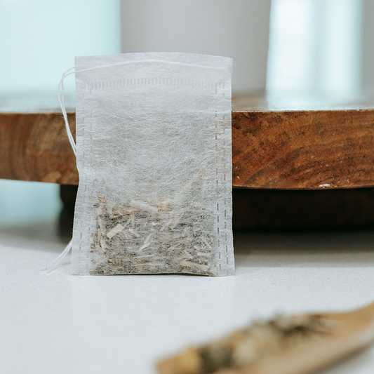 biodegradable drawstring tea bags from IngenuiTea™ with tea inside